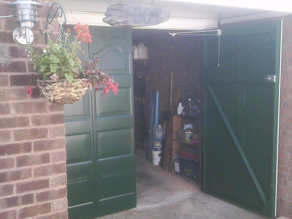 green side hinged garage door